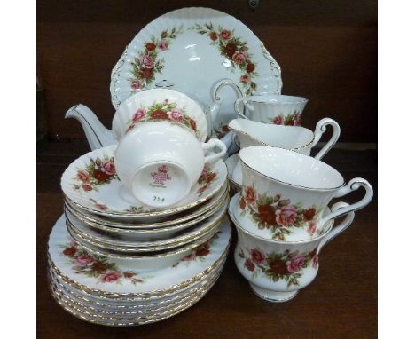 English Rose pattern teaware set comprising a teapot, milk/cream jug and bowl, cake/sandwich plate, six small plates, six sau