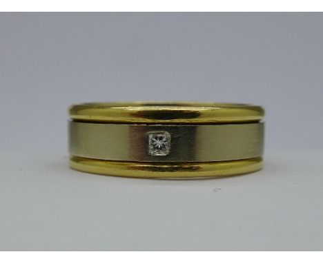 An 18ct two tone gold and diamond ring, weight 7.9g, size R½