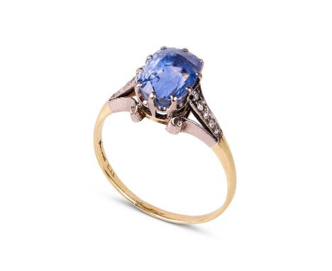 A Victorian sapphire and diamond dress ring, set with a natural cornflower blue oval mixed cut sapphire, approximately 9.82mm