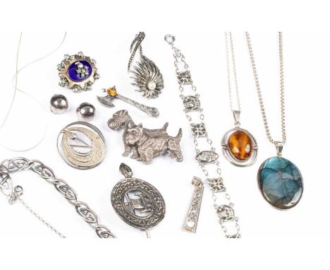 A quantity of silver jewellery, mainly Scottish, including an axe form brooch, a Viking brooch and bracelet, a Celtic bracele