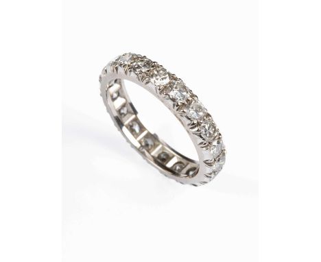 A white metal and diamond full eternity ring, set with twenty round brilliant cut diamonds, estimated total diamond weight ap