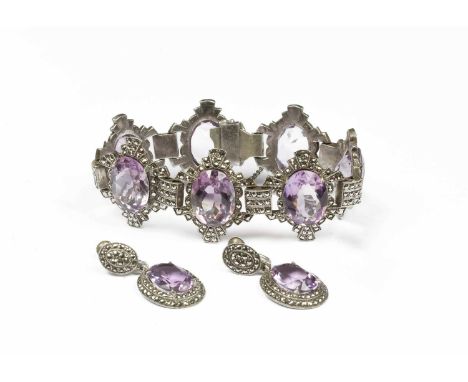 An Art Deco amethyst and marcasite bracelet and earrings, the bracelet set with seven oval amethysts approximately 16mm x 12m