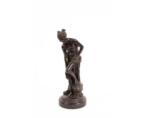 After Christophe-Gabriel Allegrain (1710-1795), a patinated bronze figure, Venus au bain, on a circular plinth, 39cm highGene