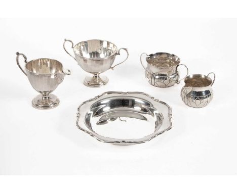 A Victoria silver milk jug and sugar basin, London 1818, decorated in the 17th Century style and another jug and basin, W &am