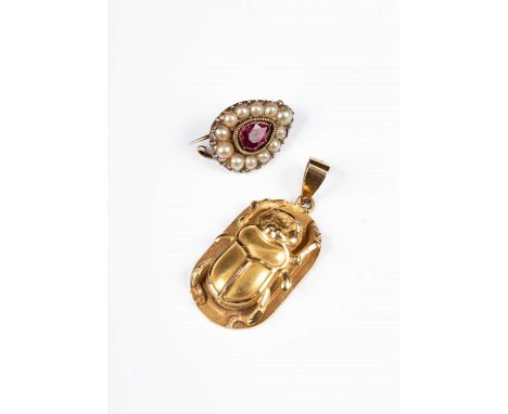 An Egyptian gold pendant cast in relief with a scarab beetle and symbols to reverse, Egyptian control marks, assessed as appr