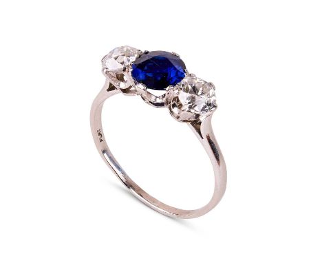 A sapphire and diamond three-stone ring, the central round cut sapphire approximately 7.90mm x 7.92mm x 3.69mm, flanked by tw