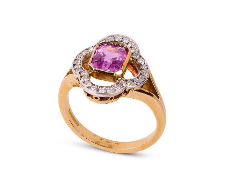 A pink sapphire and diamond dress ring, circa 2001, the canted rectangular sapphire within a diamond set quatrefoil, to an 18