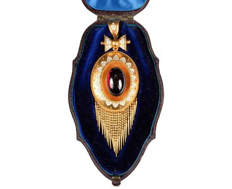 A Victorian cabochon garnet and enamel pendant of oval shape centred by an oval cabochon garnet within an Etruscan style enam