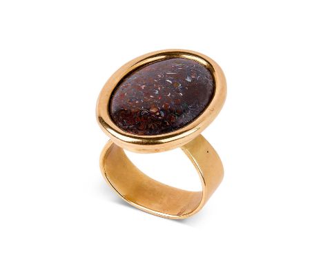 ARR Andrew Grima (1921-2007) a gold and matrix opal ring, the oval cabochon opal set in a plain oval setting, the opal 3cm x 