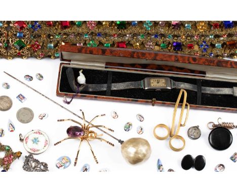 A quantity of costume jewellery, including a silver and enamel circular locket pendant, an engine turned enamel painted with 
