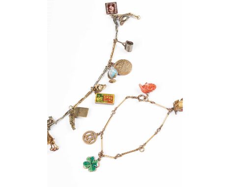 An early 20th Century bi-colour gold trombone link charm bracelet, stamped '18', suspending various charms of 9ct and 18ct, i