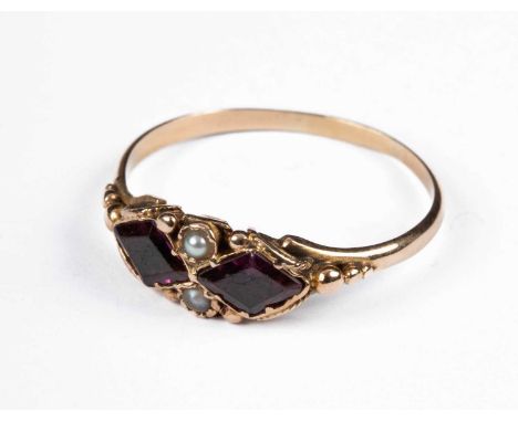 A Georgian gold dress ring, set with two foil backed amethyst glass stones and two seed pearls in closed back settings, ring 