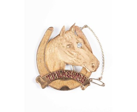 Horse racing interest: A 9ct gold, diamond and ruby brooch, AJ, 1994, the special commission modelled as a horse's head with 