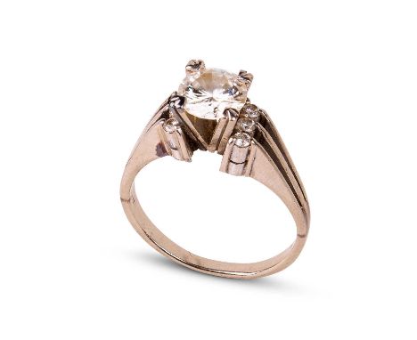 An 18k white gold and diamond solitaire ring with claw set round brilliant-cut diamond, approximately 1ct, with six smaller d
