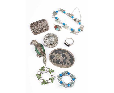 A Mexican silver and enamel bracelet and matching brooch, having green enamel leaves and blue berries, brooch approximately 4