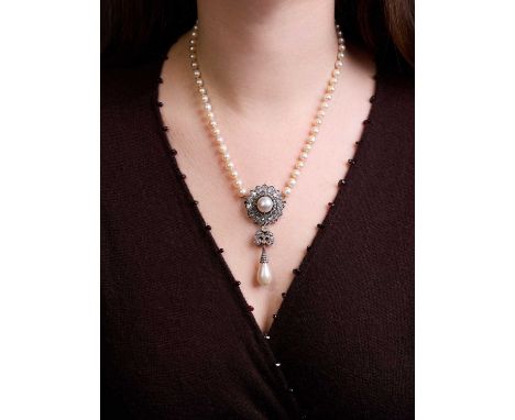 A Victorian natural pearl and diamond pendant/brooch, the main cluster centred by an undrilled button pearl of 8.46ct to a su
