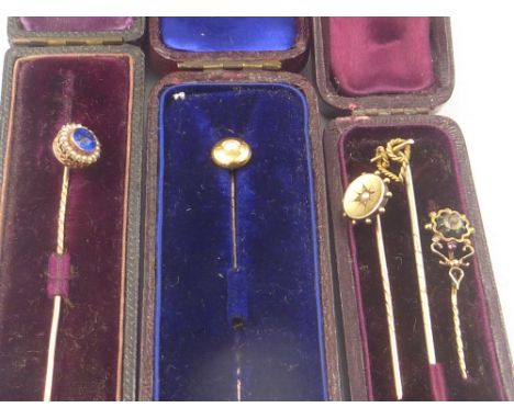 Five gold and other scarf pins various.