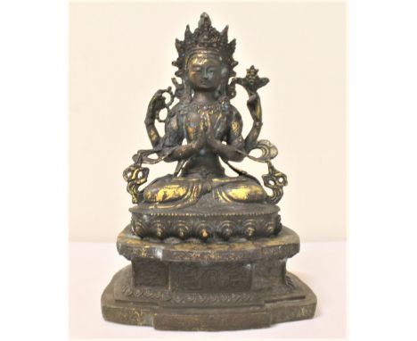 Late 19th century/early 20th century Sino-Tibetan bronze figure of a deity seated on  lotus throne, possibly Vishnu, with tra