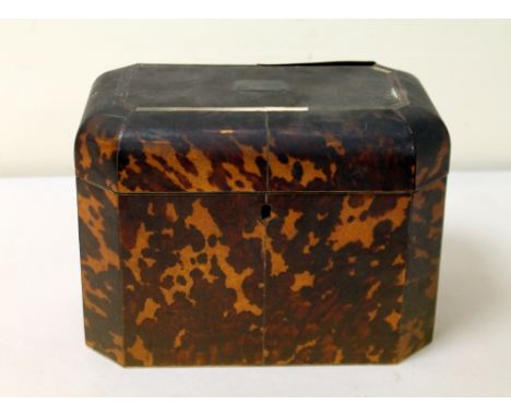 Georgian tortoiseshell veneered tea caddy of canted rectangular form with domed lid, the interior with two lidded compartment