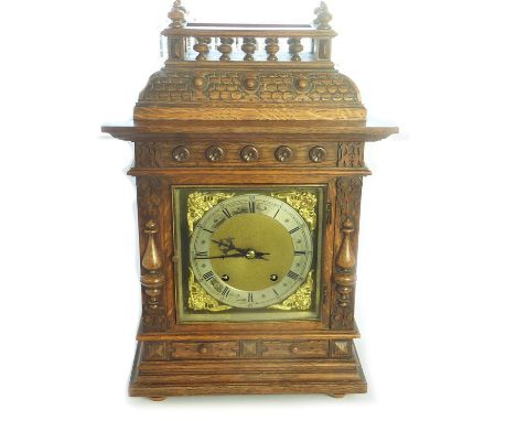 Eight day mantel clock by Winterhalder, chiming on two gongs with brass and silvered dial in oak case with gallery top. 47cm 