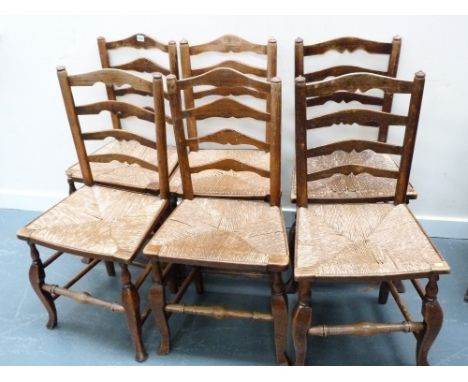 Set of six ladder back country chairs with rush seats and turned front stretchers.