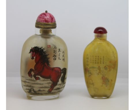 Two 20th century Chinese internally decorated glass snuff bottles, one painted with two horses, inscription and seal,with red