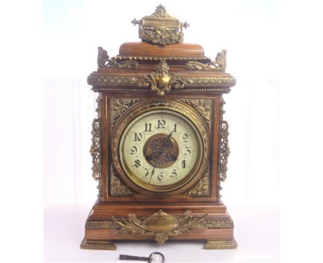 French mantel clock in oak case with brass mounts, inscribed and dated 1895. 43cm.   Condition Report. Nice condition and app