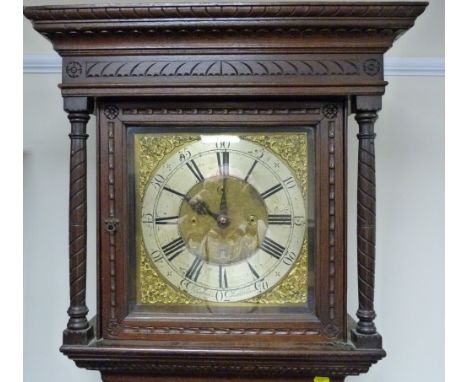 Thirty hour longcase clock by Reynolds, Kirkbride with nicely engraved silvered and brass 11½" dial in carved oak case.