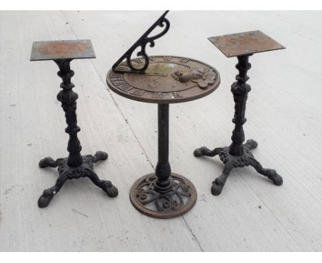 Modern cast garden sundial with frog on lily pad detail to the top in the antique style together with two cast table stands. 
