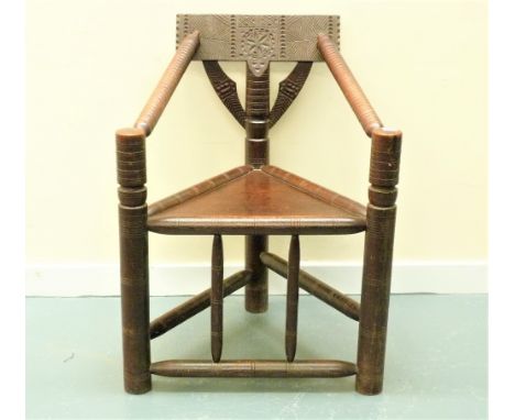 19th century oak turners chair, the chip carved top rail and bobbin turned arms over turned legs and stretchers. 