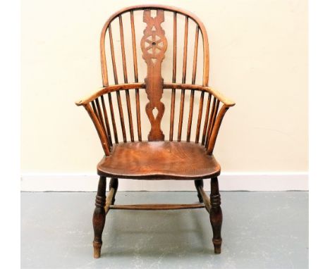 19th century Windsor wheel-back and stick arm chair.