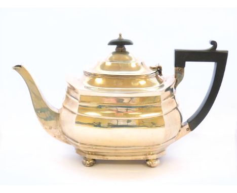 Silver teapot of oval panelled shape by Nathan & Hayes Chester 1914.  Condition Report. 15oz.