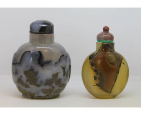 Two late 19th/ early 20th century Chinese shadow agate snuff bottles, one grey with dark inclusions and grey stopper, 8cm hig