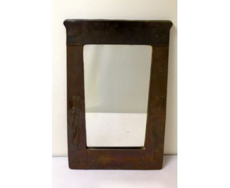 Liberty & Co. Arts and Crafts copper wall mirror in the manner of Archibald Knox, the tapered rectangular frame with repousse