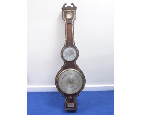 Fine early Victorian wheel barometer by Williamson, Royal Exchange, silvered dial with engraved globe at the centre and finel