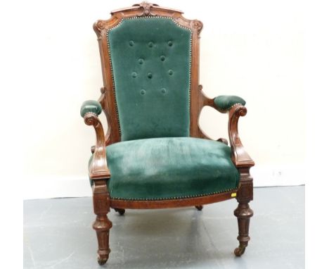 Victorian walnut open armchair, upholstered seats, arms and button back on reeded tapered supports