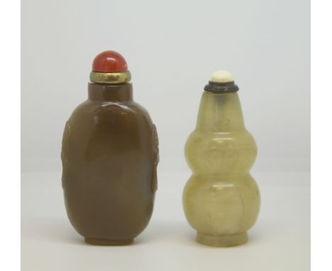 Two 19th century Chinese small agate snuff bottles, one light brown with striations, carved taotie masks and red stone and gi