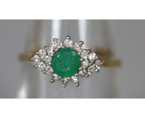 18ct gold emerald and diamond ring. Ring size M&1/2. Approx weight. (B.P. 21% + VAT) Emerald approx. 4mm.  Diamonds are appro