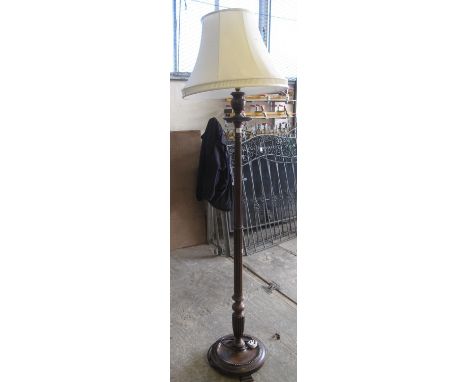 Modern mahogany standard lamp on a circular moulded base with shade.  (B.P. 21% + VAT) 