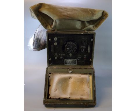 U.S Army World War II Signal Corps frequency meter, made by the Rauland Corporation, Chicago, Illinois. Together with a U.S A