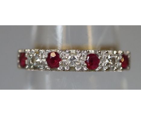 18ct gold ruby and diamond half eternity style ring. Ring size M&1/2. Approx weight 2.8 grams. (B.P. 21% + VAT) Condition is 