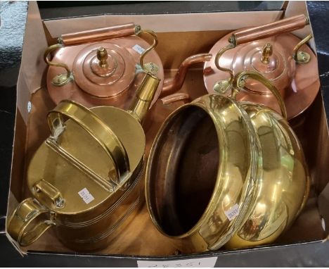 Two vintage copper teapots together with an arts and crafts design two handled baluster jardinière and a brass watering can. 
