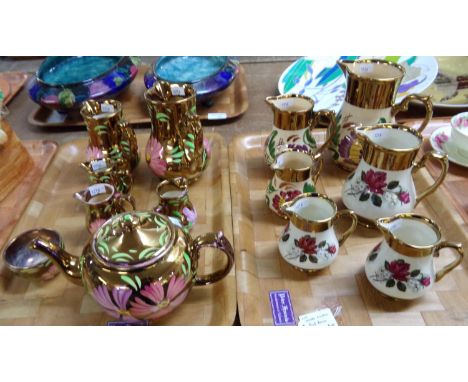 Two trays of Wade lustre floral jugs., bullet shaped tea pot, sucrier and cream jugs.  (2)  (B.P. 21% + VAT) 