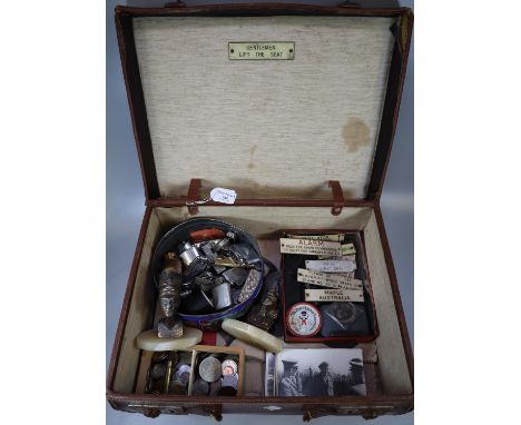Leather suitcase, to include: vintage GWR wooden carriage warning tags, various lighters, coins, cut throat razors, postcards