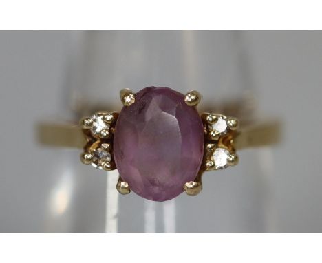 9ct gold purpe stone ring set with diamonds.  Ring size M & 1/2.  Approx weight 3.2 grams.(B.P. 21% + VAT) 