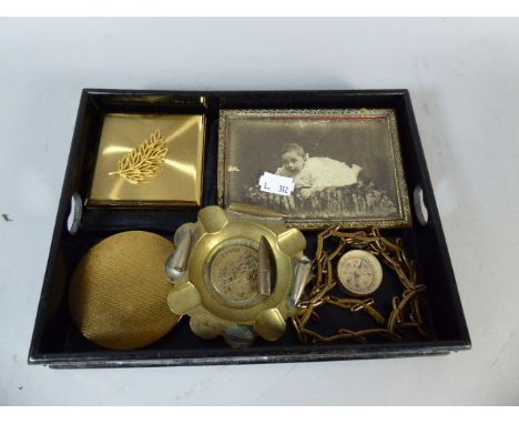 A Silver Mounted Ebonised Tray Containing Vintage Powder Compacts, Ash Tray, Compass, Photo Frame Etc