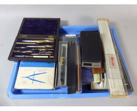 A Tray Containing Parker and Other Pen Sets, Slide Rules, Vintage Casio Calculator, Drawing Sets Etc