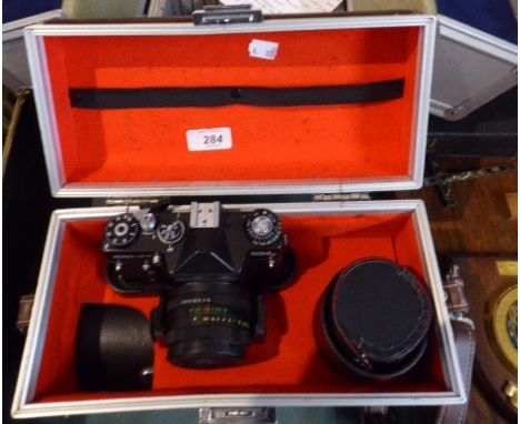 A Cased Zenith Camera, Telephoto Lens, Tele Converter, Flash Gun Etc