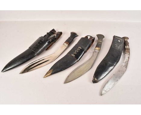 A Group of three Middle Eastern Kukri Knives, different sized blades, with sheaths, some smaller knives missing, no postage f