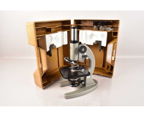 An Olympic Monocular Microscope, number 551584, in fitted case with instructions